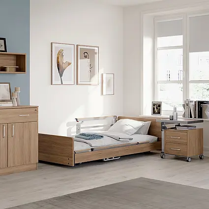Resident’s room in a nursing home with a care bed and furniture Resident’s room in a nursing home with a care bed, bedside cabinet and homelike furniture by Stiegelmeyer.