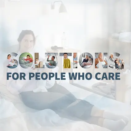 Imagen de una madre y su recién nacido en una cama de hospital, junto con el lema "Solutions for people who care", que representa las soluciones del Grupo Stiegelmeyer para el sector sanitario.